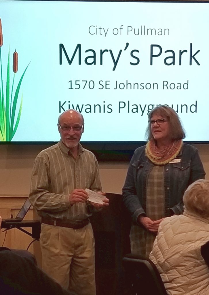 Alan Davis from Pullman Parks and Rec with Pullman Kiwanis President Ginger Flynn as the Kiwanis Club gives $25,000 for Mary's Park