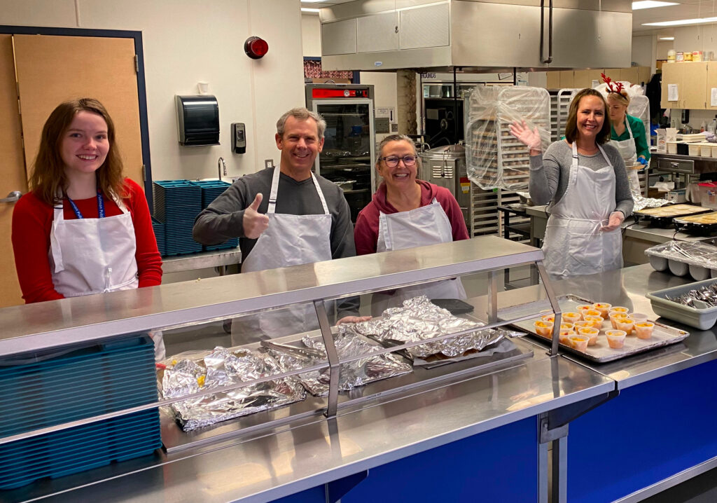 People serving food at Pullman Kiwanis Pancake Breakfast in 2022